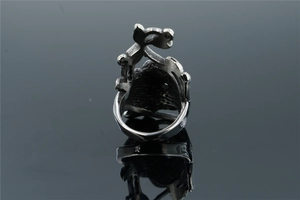 Detail view of a silver stainless steel ring featuring a vintage hollow cat silhouette