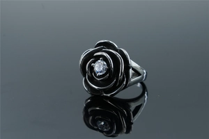 Macro shot of gothic stainless steel rose ring with inlaid crystal and antique silver finish