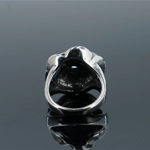 Vintage stainless steel rose ring featuring a polished blue round gemstone inlay