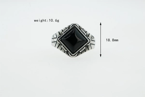Macro detail of vintage men's stainless steel ring showing 10.6g weight and 18.8mm width
