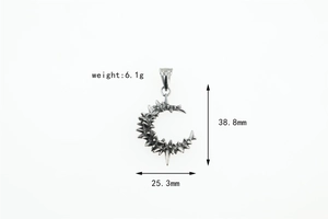 Macro detail of gothic crescent moon pendant with spiked design and size measurements
