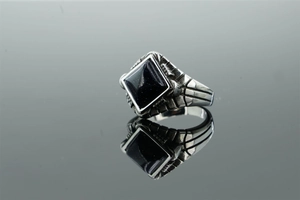Detailed view of men's vintage stainless steel ring featuring a square blue goldstone inlay