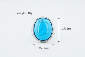 Macro detail of turquoise ring with engraved silver bezel and weight measurement of 18g