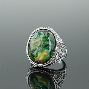 Retro stainless steel ring with colorful oval stone and vintage hollow pattern design