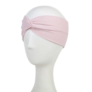 Close-up of light pink ribbed knit headband featuring a stylish center twist detail
