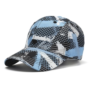 Close-up of blue and black camouflage baseball cap with street style graffiti and patterns
