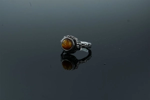Macro shot of retro vintage ring with blue turquoise and intricate floral engravings