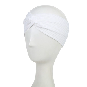 Detailed view of ivory white knotted headband showing the elastic ribbed fabric texture