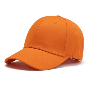 Close-up of vibrant orange twill cotton baseball cap showing stitching and eyelets