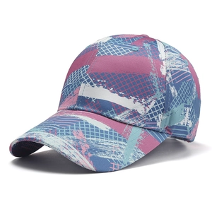 Women's pink and blue camo baseball cap with abstract graffiti pattern on white background