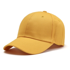 Detail view of bright yellow cotton twill baseball cap showing stitch and eyelet quality