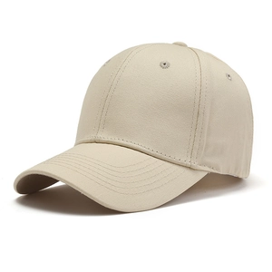 Detail view of a beige cotton canvas baseball cap with six-panel design and curved brim