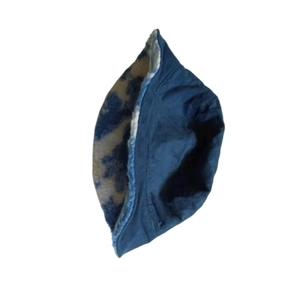 Detailed view of plush rainbow faux fur lining inside a dark blue bucket hat