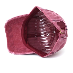 Detail of vintage washed cotton cap showing the metal buckle and internal structure