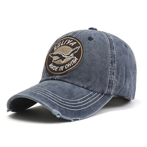 Retro washed blue baseball cap with eagle patch and white contrast stitching detail