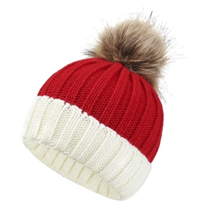 Red and white knit beanie with brown faux fur pom pom for winter warmth and style