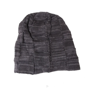 Close-up of the dark grey checkered knit texture on the warm winter beanie hat