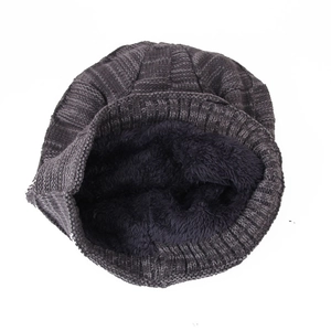 Detail of warm winter knit hat showing thick black fleece lining and textured grey knit