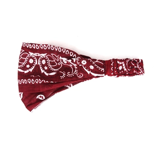 Close-up of red paisley elastic headband showing vintage pattern and soft fabric texture