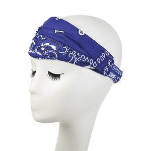 Detailed close-up of navy blue paisley bandana headband on a female model head
