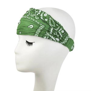 Close-up of green paisley elastic headband on a model head for yoga and sports