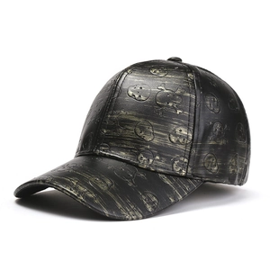Distressed black PU leather baseball cap with gold skull pattern and punk style