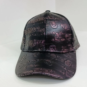 Detail view of vintage PU leather baseball cap featuring embossed skull and crossbones texture