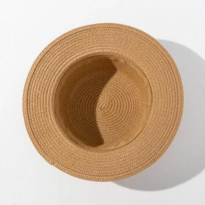 Detailed view of the spiral straw weaving and sweatband inside the flat top sun hat