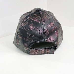 Detail of black punk baseball cap featuring 3D skull patterns and adjustable back strap