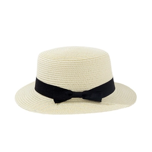 Elegant wide brim boater straw hat with black ribbon and bow detail for summer sun protection