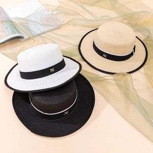 Three elegant flat-top straw hats in white, beige, and black with M metal logo