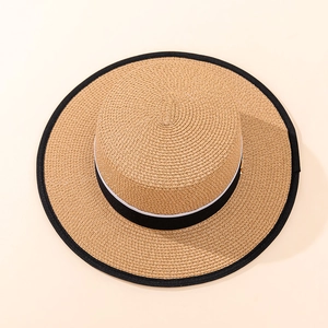 Top view of classic flat top straw boater hat with black ribbon and contrast piping edge