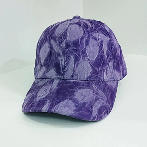 Close-up of purple baseball cap showing unique crinkle texture fabric and reinforced brim
