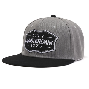 Detail view of the embroidered City Amsterdam 1275 shield patch on a snapback hat