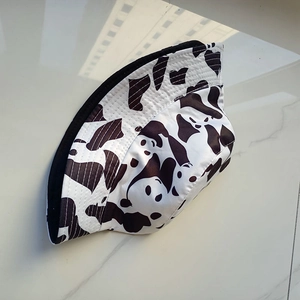 Detail showing the reversible design and cute panda print on this black bucket hat