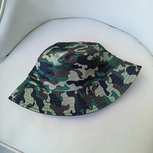 Detailed view of camouflage hiking boonie hat with breathable fabric on white background