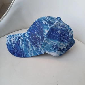 Detail of blue and white sea wave pattern print on premium twill baseball cap fabric