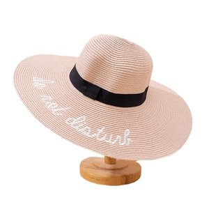 Women's wide brim straw sun hat with do not disturb embroidery and black ribbon bow