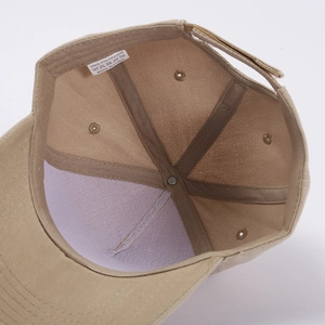 Detail view of khaki baseball cap interior showing 100% polyester fabric and seams