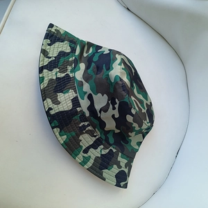 Detail view of jungle camouflage sun hat with reinforced stitching and durable canvas texture