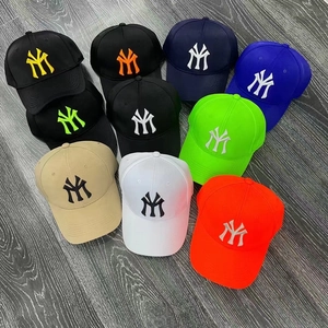 Detailed view of NY logo embroidery on colorful cotton baseball caps for sun protection