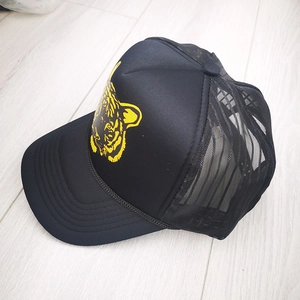 Black mesh trucker hat with yellow tiger head print and breathable sun protection