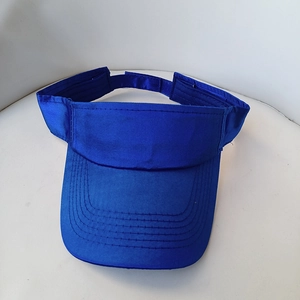 Detail view of royal blue sports sun visor hat with reinforced stitching and velcro strap
