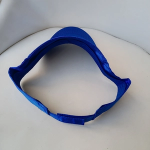 Detailed view of the adjustable velcro strap on royal blue open top visor sun hat