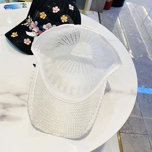 Women's hollow knit baseball caps in black and white with floral 3D accents