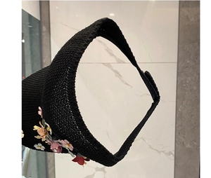 Black woven sun visor hat with colorful 3D floral decorations and wide brim for summer travel