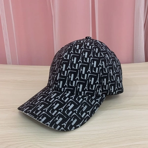 Close-up of the black baseball cap with Eiffel Tower and letter H A patterns