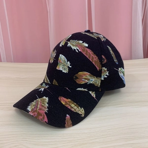 Unisex baseball cap with colorful feather print on black fabric and stiff sun visor