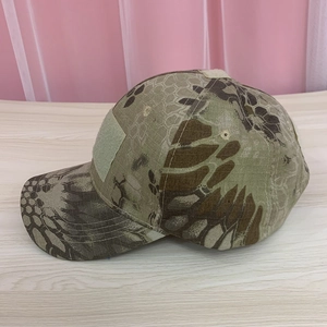Close-up of tactical camo baseball cap showing front velcro patch and breathable eyelets