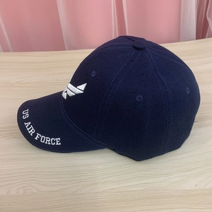 Detail of navy cotton baseball cap featuring US AIR FORCE embroidery and wing logo